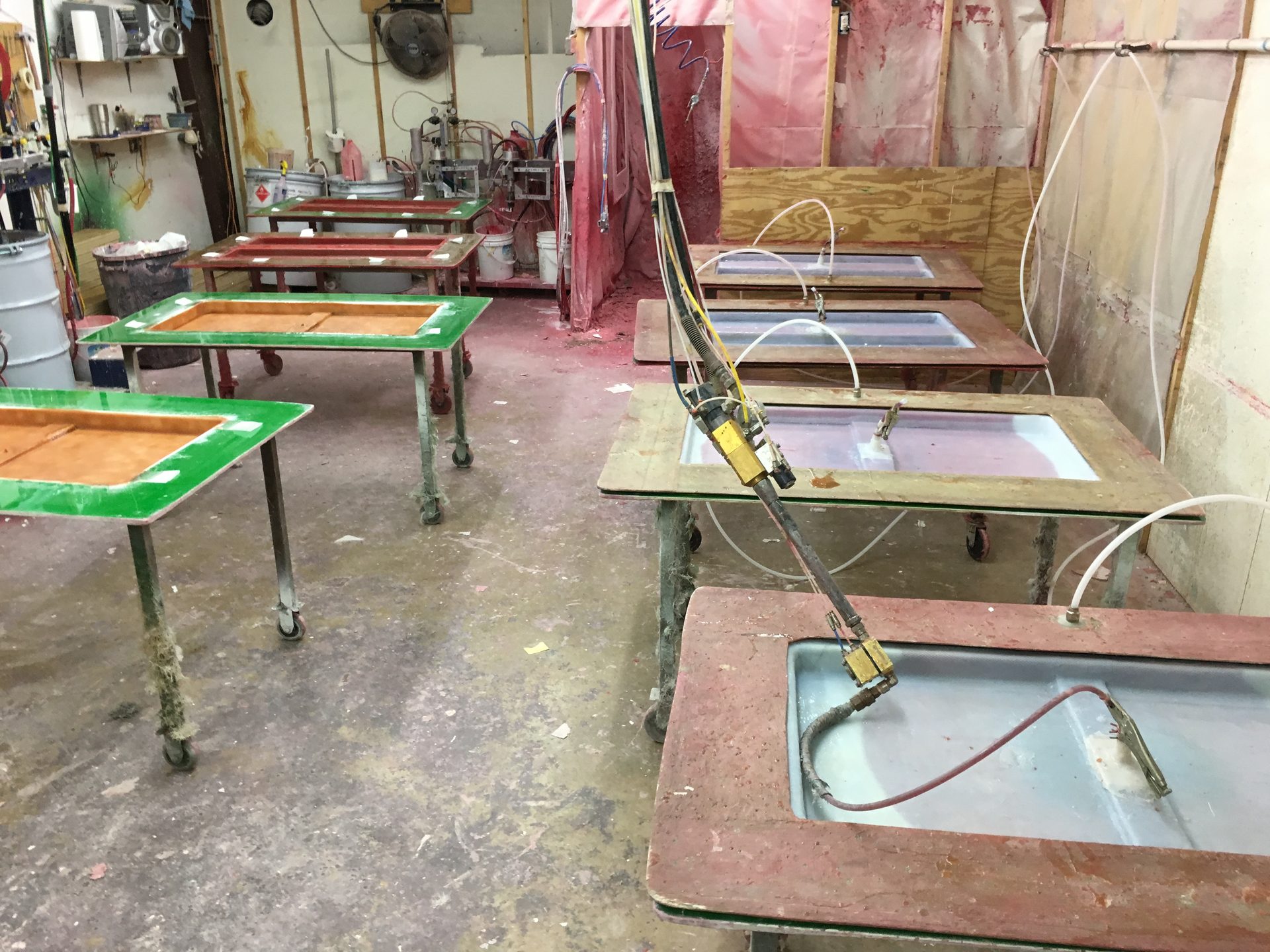 Production molds staged on tables across the shop floor