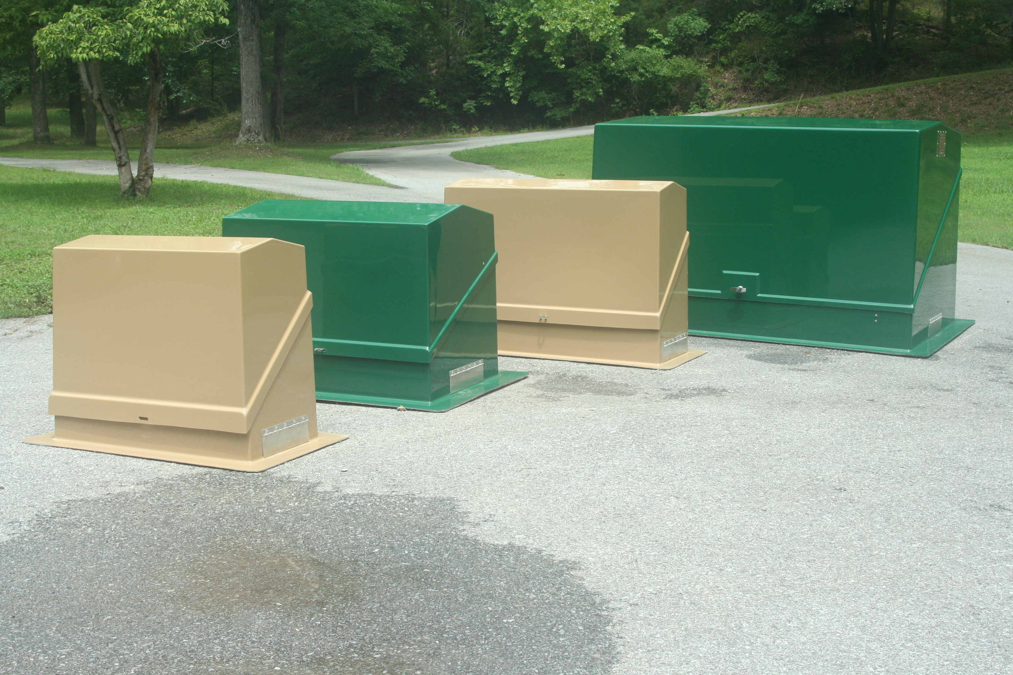 Green and beige Rbox insulated enclosures lined up on pavement